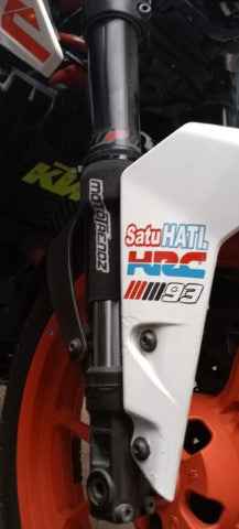Mototrendz fork seal cover installed on motorcycle front fork