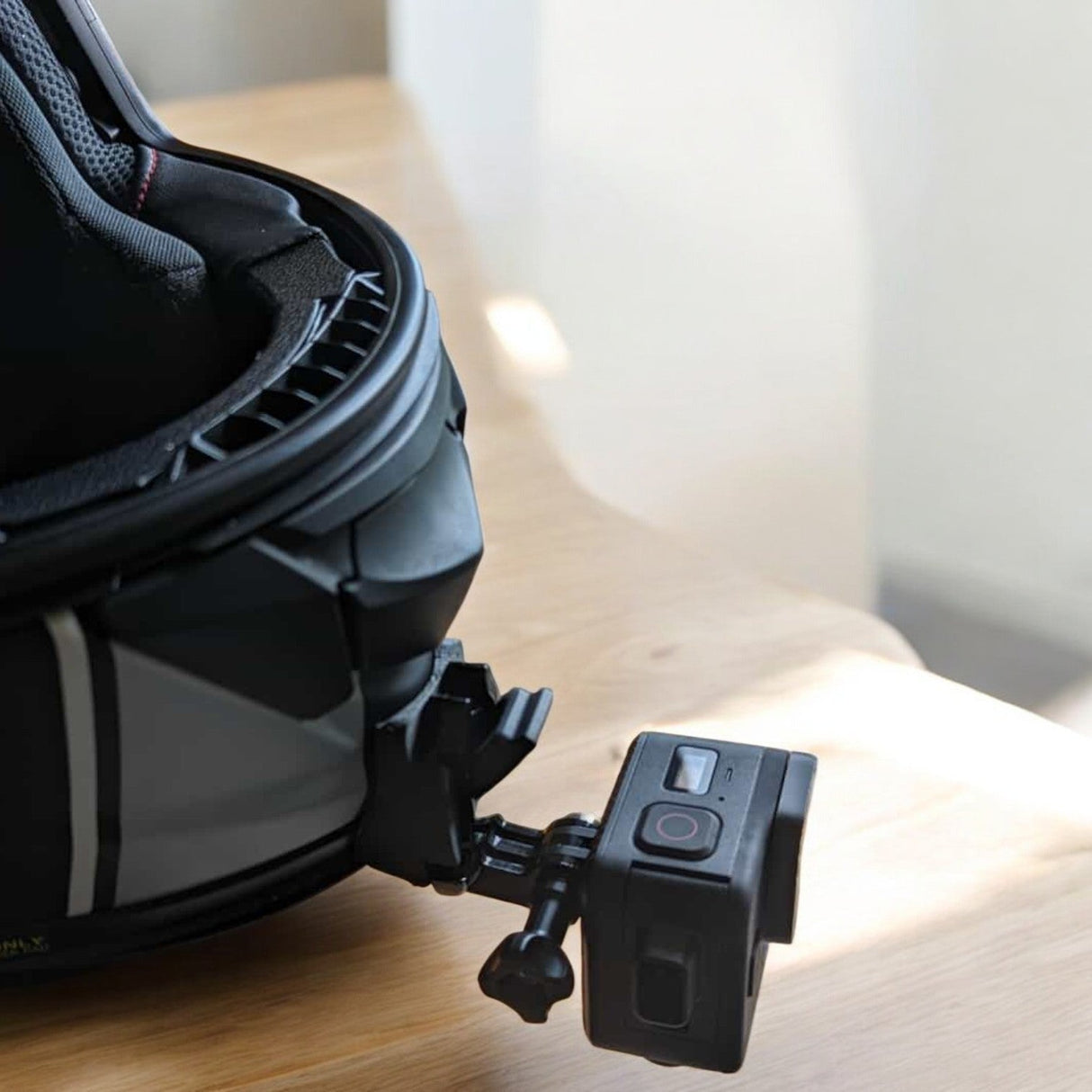 SHOEI GT-Air 2 helmet chin mount installed for GoPro and Insta360 POV motovlogging camera setup on motorcycle helmet