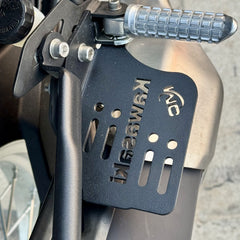 Motocare footrest foot pegs installed on Kawasaki Versys 300 for improved riding comfort and grip
