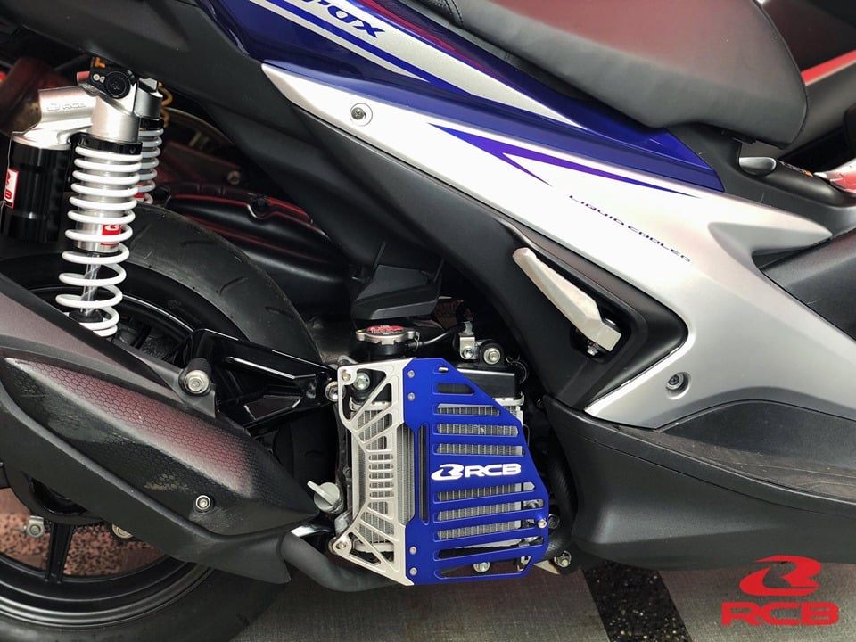 RCB S Series 01IR007 CNC aluminium motorcycle radiator cover with mesh airflow design in Gold/Silver, Blue/Silver and Black/Red colour options.