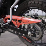 MotoCare red chain guard installed on Hero XPulse 210 protecting chain and sprocket system