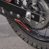 MotoCare red chain sprocket guard installed on Hero XPulse 210 protecting chain and sprocket system