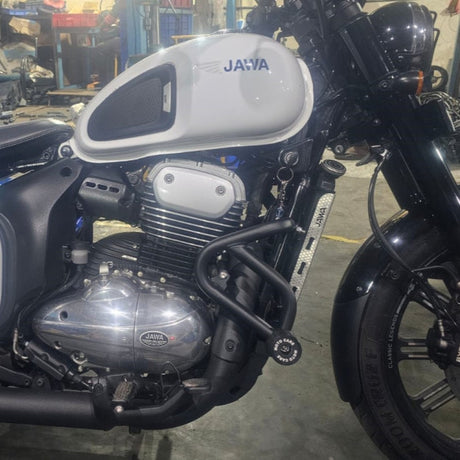 MotoCare crash guard with dual sliders installed on Jawa 42 Bobber motorcycle for engine and frame protection during impact