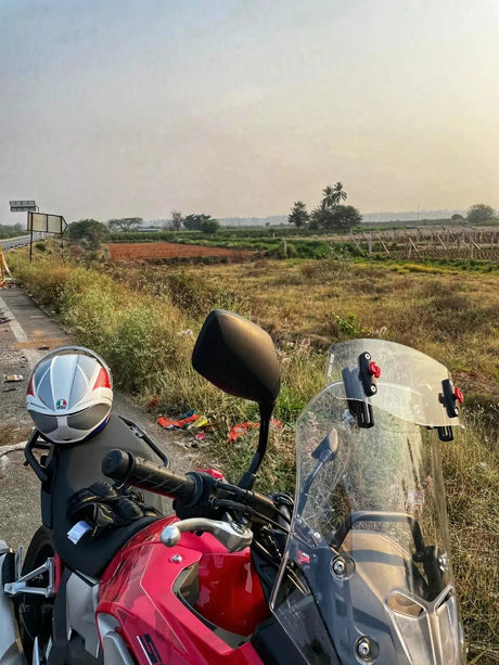 Pro-Spec ER 720 universal windshield lip extender mounted on adventure motorcycle