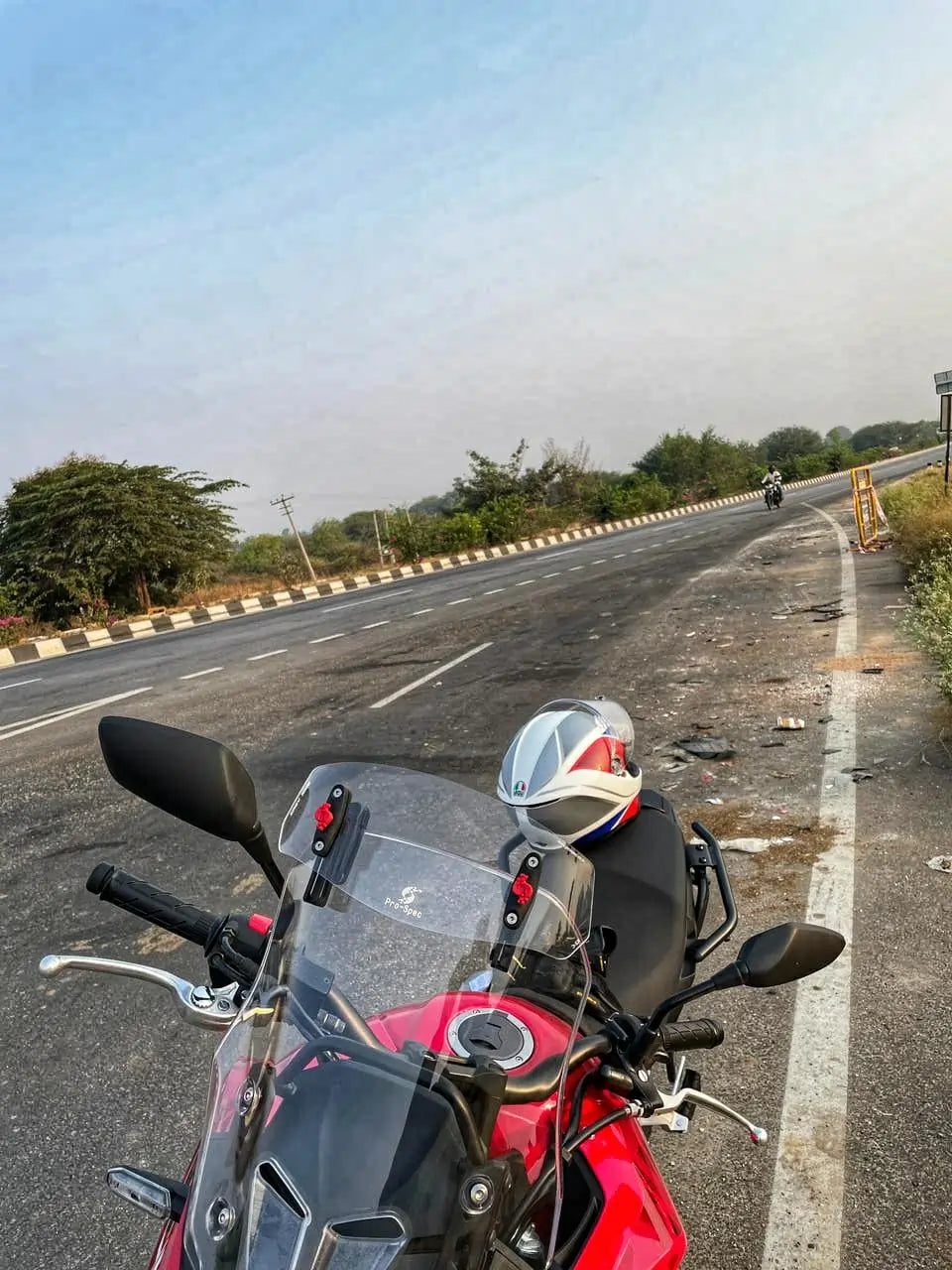Pro-Spec ER 720 universal windshield lip extender mounted on adventure motorcycle