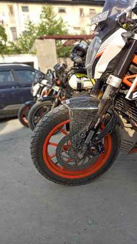 Mototrendz fork seal cover installed on motorcycle front fork