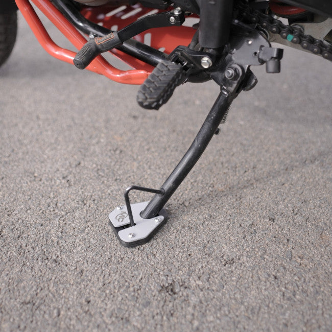 MotoCare side stand extender installed on Hero XPulse 210 for improved parking stability