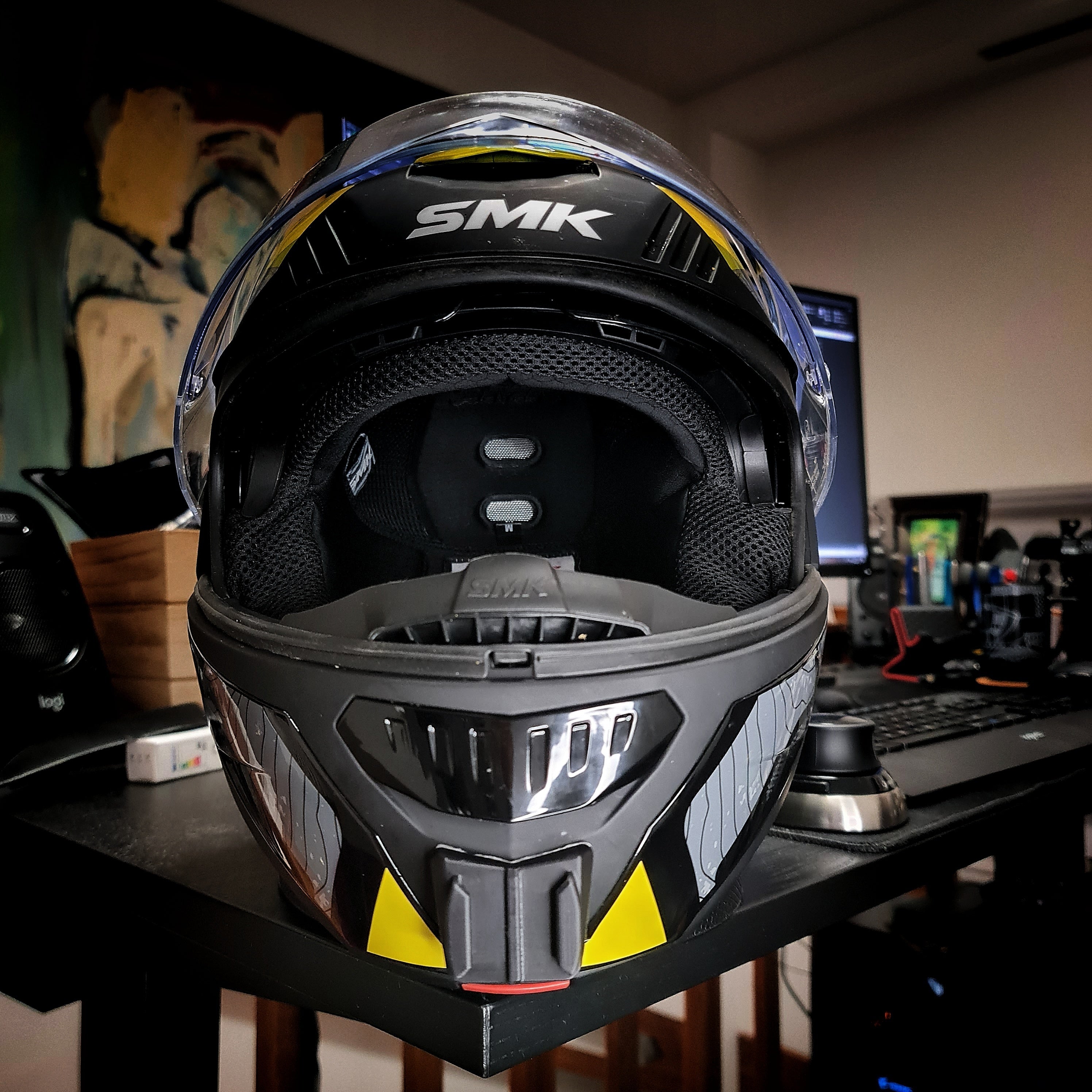 SMK Tourer helmet chin mount installed for GoPro Insta360 DJI POV touring motovlogging action camera setup on motorcycle helmet