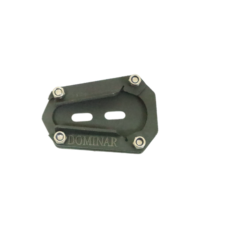 Motocare Dominar 400 stand extender installed on Bajaj Dominar 400 side stand providing enhanced stability and anti-sink support on ground