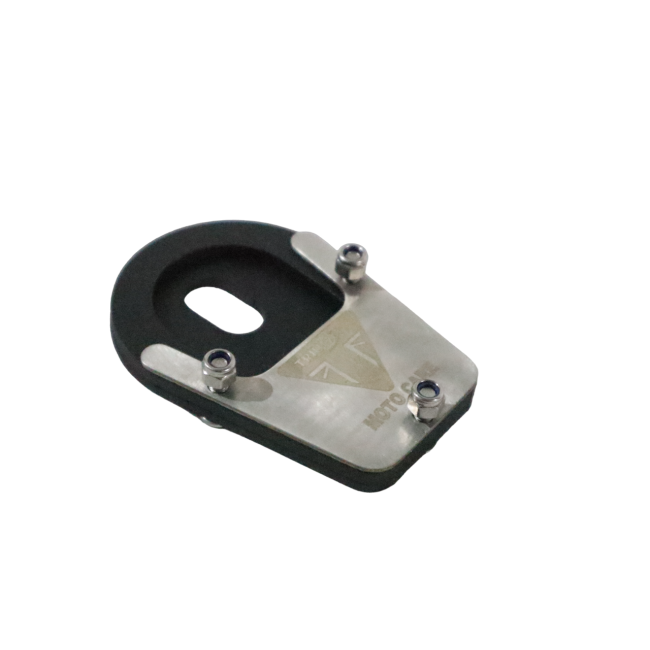 MotoCare stand extender installed on Triumph Scrambler 400X showing enlarged side stand base plate for improved parking stability