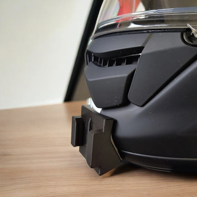 SHOEI GT-Air helmet chin mount installed for GoPro and Insta360 POV motovlogging camera setup on motorcycle helmet