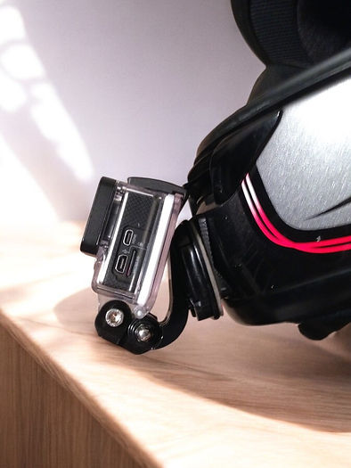SHOEI RF-1000 helmet chin mount installed for GoPro and Insta360 POV motovlogging camera setup on motorcycle helmet