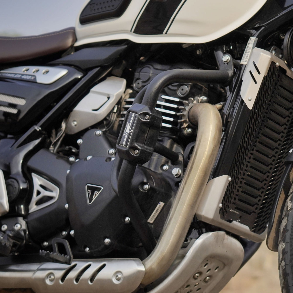 Auto Engina textured black crash guard with built-in sliders for Triumph Scrambler 400X motorcycle