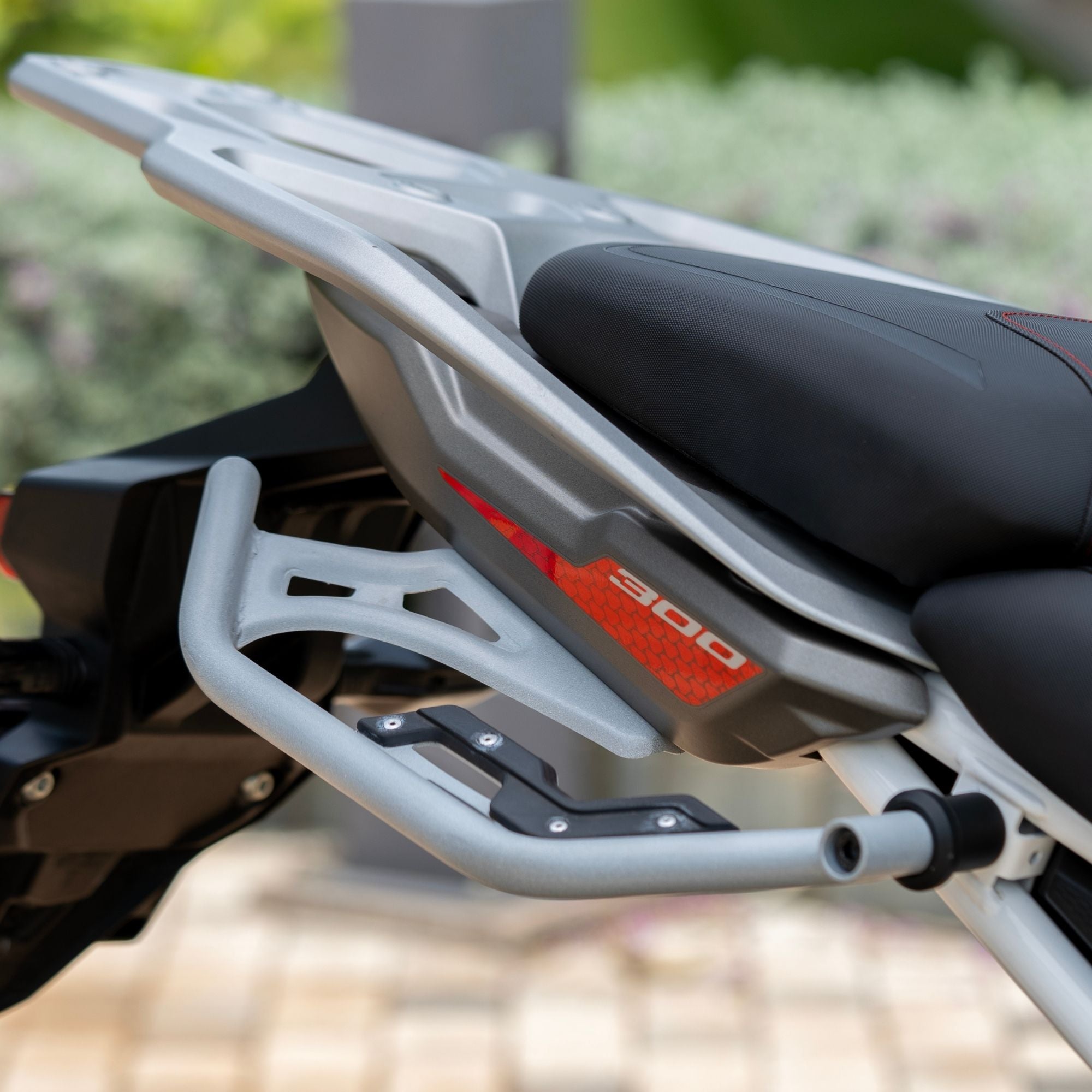 Auto Engina Mirage Silver Saddle Stay installed on TVS Apache RTX 300 for soft saddle bag and touring luggage support